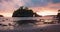 Static view of ocean from the shore. Small tropical Island with Idyllic lagoon at colorful sunset. Crystal Bay Beach in