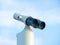 Stationary binocular against clear blue sky