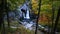 Stationary view of Magical blue waterfall in New York fall with yellow foliage