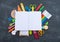 Stationery chalk board. Back to school. Open notepad on top of office supplies