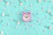 Stationery chaotically scattered on a bright blue background. White paper clips, clerical buttons and small pink stars