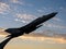 Statue of an airplane taking off into the sky at sunset, dedicated to the air force.