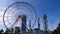 Statue of Ali and Nino and Ferris Wheel against the Alphabet Tower on the Embankment of Batumi