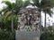 Statue amid palm trees outside University of Tampa