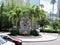 Statue amid palm trees outside University of Tampa