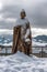 Statue of Andrej Hlinka covered by snow