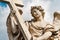 Statue of angel on St. Angelo Bridge, in front of Castle of St. Angelo, Rome