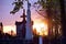 Statue of an angel at sunset in an old cemetery