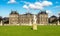A statue of Artemis on a beautiful green lawn in front of Luxembourg Palace, Paris