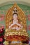 Statue of Avalokitesvara sitting on lotus flower