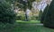 Statue of Balzac amongst sculpted trees on the Rodin Museum grounds