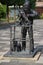 Statue of a blacksmith in cast iron, holding two keys, the coat of arms of the municipality of Waddinxveen in the Netherlands