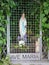 Statue of the Blessed Virgin Mary of Lourdes chained with wire in front of the Church of the Nativity of the Blessed Virgin Mary.