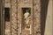 Statue in a brick wall on the Roman Forum building at Merida