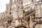 Statue of a brooding commander on the facade of the Duomo. Italy, Milan