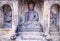 Statue of Budda along side with Hindu Gods and Goddesses carved in a stone. Selective Focus