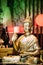 Statue Of Buddha Sitting In Lotus Position With Raised Right Arm