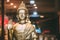 Statue Of Buddha Sitting In Lotus Position With Raised Right Arm Gesture Showing Dispute,