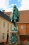 The statue of Chancellor Peder Griffenfeld and a tower in Copenhagen, Denmark