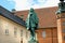 The statue of Chancellor Peder Griffenfeld and a tower in Copenhagen, Denmark