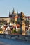 Statue on Charles Brigde against St. Vitus Cathedral in Prague