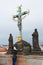 The statue of Christ on the parapet of the Charles bridge in Prague