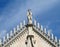 Statue of a christian saint on basilica roof