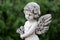 Statue of an cute infant angel cupid