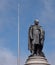 Statue of Daniel Oâ€™Connell with Spire of Dublin, on O`Connell Street, Dublin, Ireland