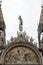 statue decorate the rooftop of the Basilica di San Marco Saint Mark`s Basilica in Venice, Italy