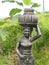 Statue of Dewi Sri goddess of rice and fertility at the entrance of a large rice paddy in the center of the island of Bali