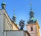 Statue and domes on the top of Holy Ghost Church. Czech Republic, Prague