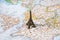 Statue of Eiffel Tower on a map, Paris most romantic tourist destination