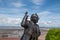 Statue of Eric Morecambe with Blue sky in Background
