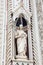 Statue on the facade of the Florence Cathedral formally called Cattedrale di Santa Maria del Fiore consecrated in 1436