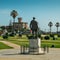 Statue of Fausto Cardoso and Baronial Estoril Castle in background overlooking the ocean