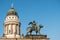Statue and french dome at Gendarmenmarkt, historic Berlin