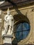 Statue in front of a window at Wawel Castle