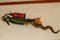 Statue of gecko with diving equipment on the wall of diving center. 3D gecko as a diver. Lizard figurine with green jacket, red