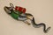 Statue of gecko with diving equipment on the wall of diving center. 3D gecko as a diver. Lizard figurine with green jacket, red