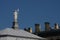 A statue of a girl with a paddle, a symbol of the Neva river, on the roof of one of the inner buildings of the fortress.