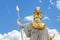 Statue of the goddess Palladus against a blue sky with clouds, rear view, sculpted in front of the Austrian Parliament