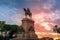 Statue of Guseppe Gaibaldi on horse with dramatic sunset backdrop