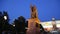 Statue of Hermogenes Germogen, the Patriarch of Moscow and all Russia inscription in Russian in front of a Kremlin wall