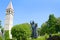 Statue of historic Croatian bishop Grgur Ninski, Gregory of Nin and ancient Clock Tower. Landmark in Split, Croatia.