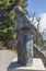 Statue in homage to the pilgrim close to the Cape Finisterre lighthouse, a landmark in the Camino de Fisterra. Galicia, Spain.