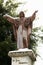 A statue of Jesus Christ covered in snow in Piazza Giovanni XXIII Avetrana, Italy