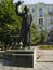 Statue of Jewish writer Sholem Aleichem in Rognedinskaya street. Sunny summer view.