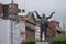 Statue of Jim Larkin on O`Connell street, Dublin, Ireland with the buildings of dublin visible behind.