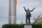Statue of Jim Larkin on O`Connell street, Dublin, Ireland with Dublin Spire behind.